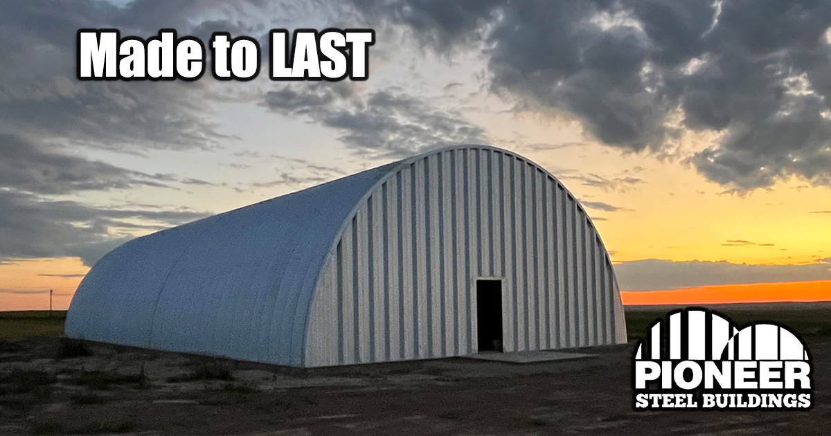 Arch building in field at sunset