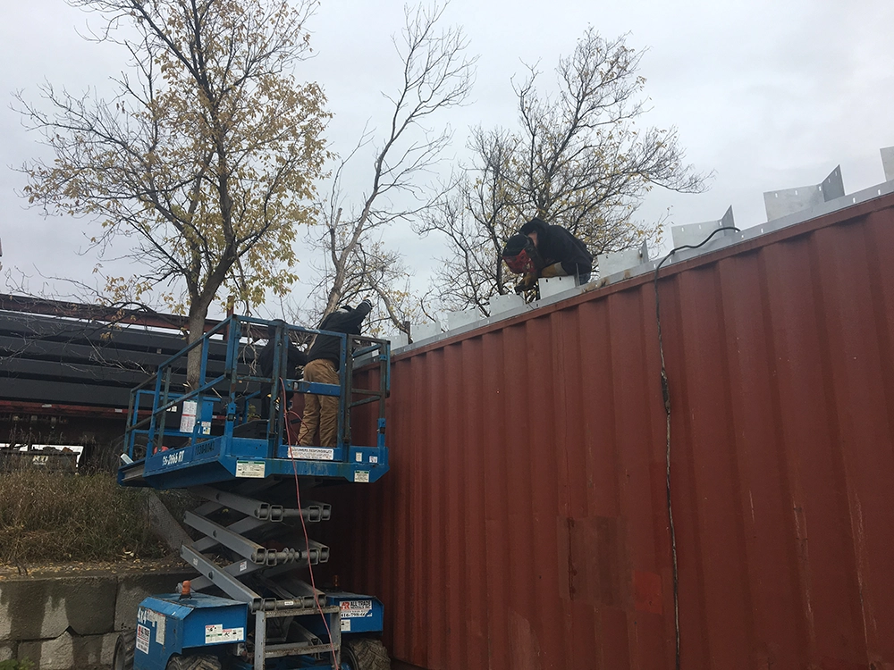 Steel container cover building